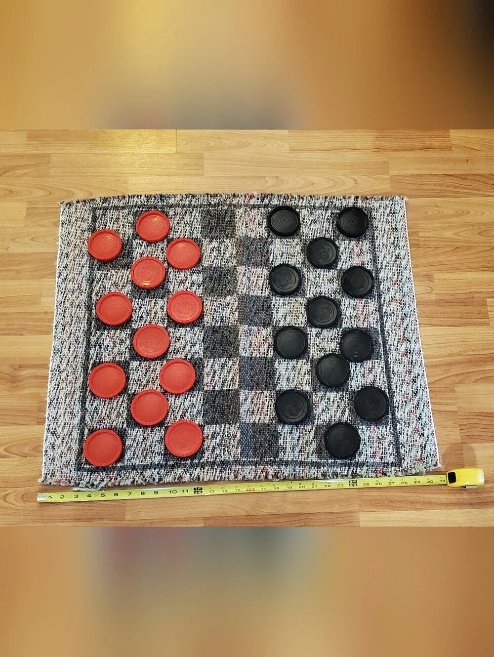 Handwoven Checkered Game Mat with Red and Black Checkers